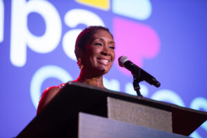 CAPACares President and CEO Dr Kristina Jones speaking at podium