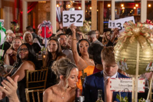 Attendees bidding on Fund a Need