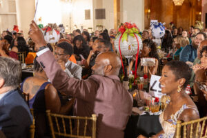 Attendees bidding on Fund a Need